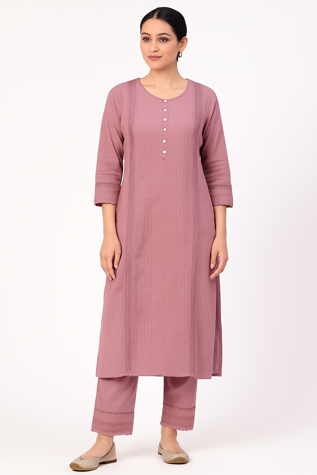 Woman wearing a grey pink kurta with pants on a white background